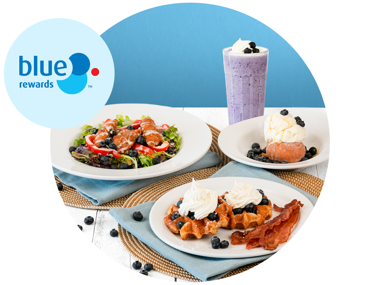 Three seafood platters with a blueberry milkshake